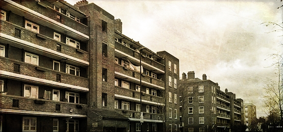 A modified colour photograph of a council tenement in central London. Image credit: Wikimedia Commons.